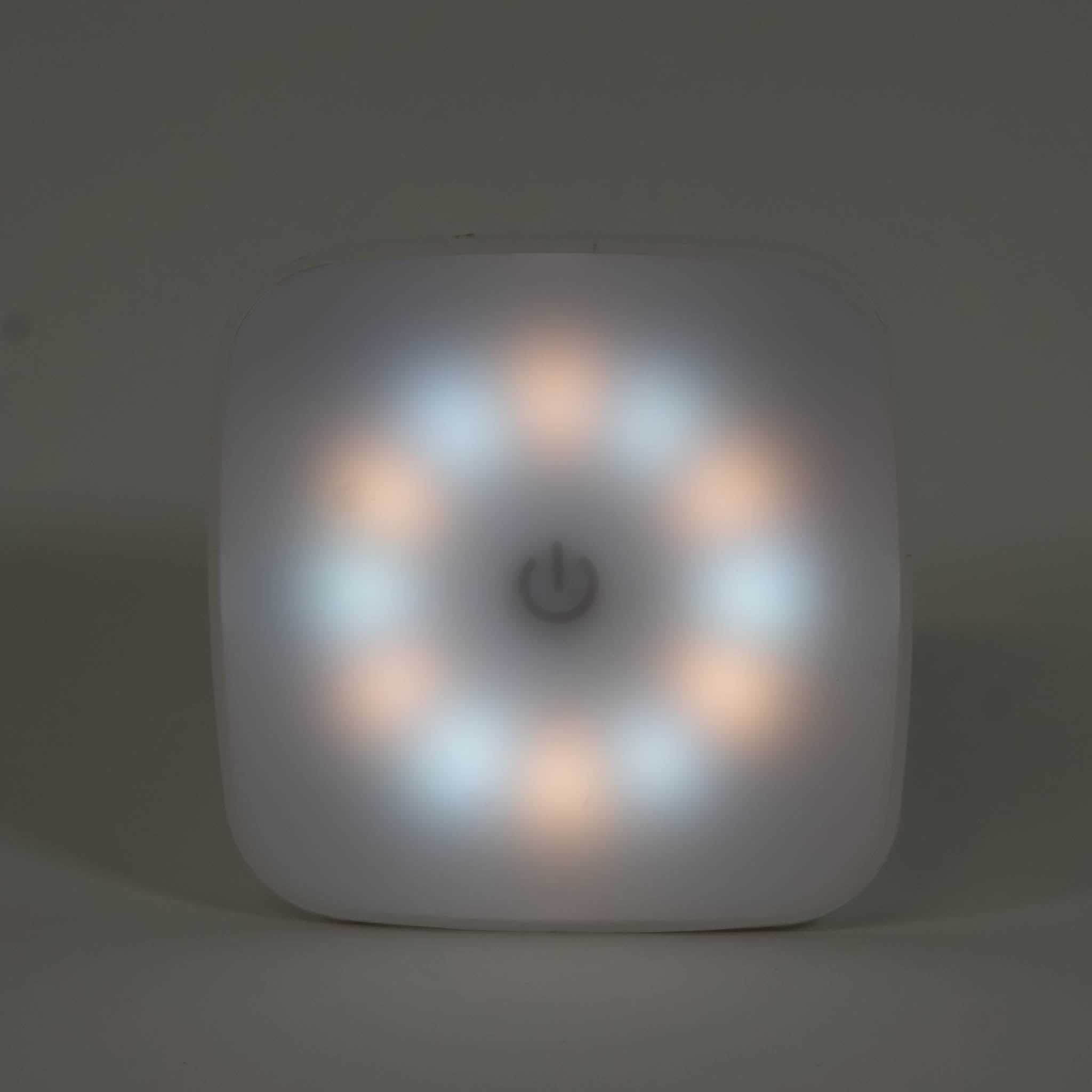 A zoomed in photo of a square night light showing a mix of cool and warm white hues.