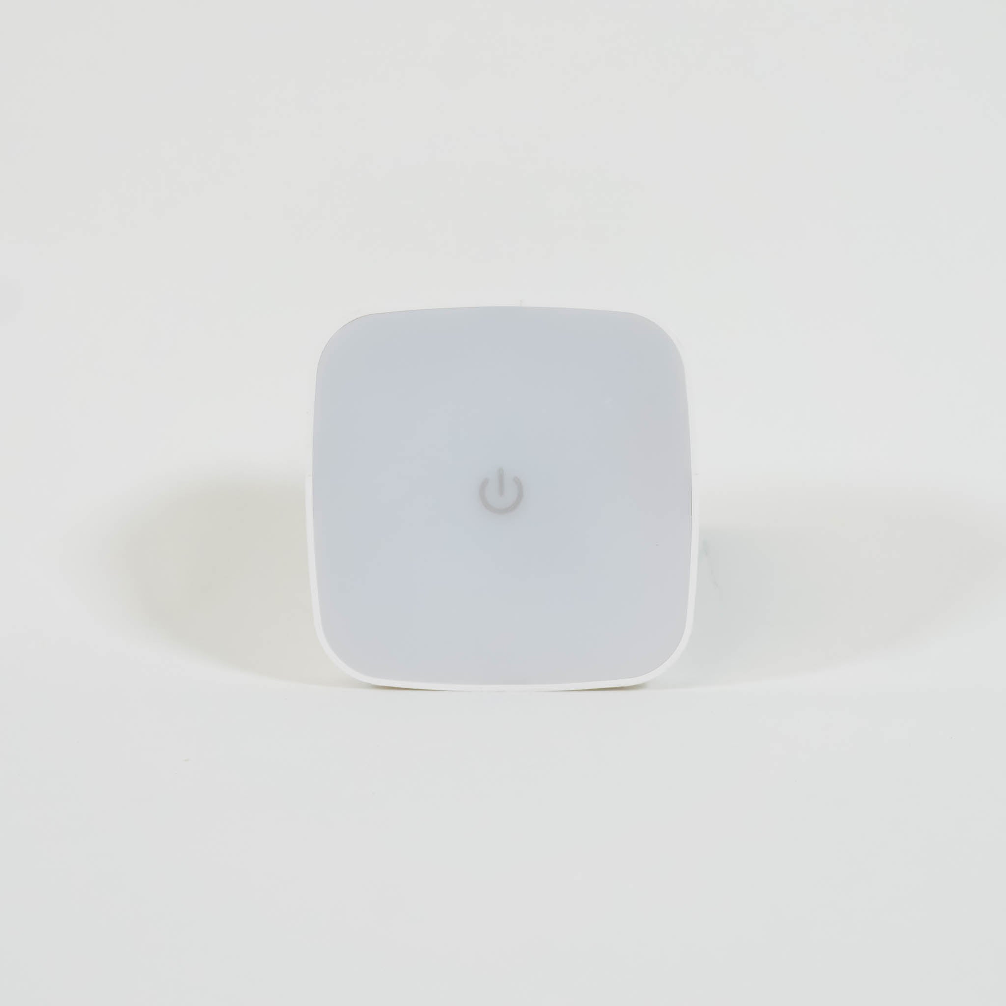 A close up of a square night light with rounded edges. 