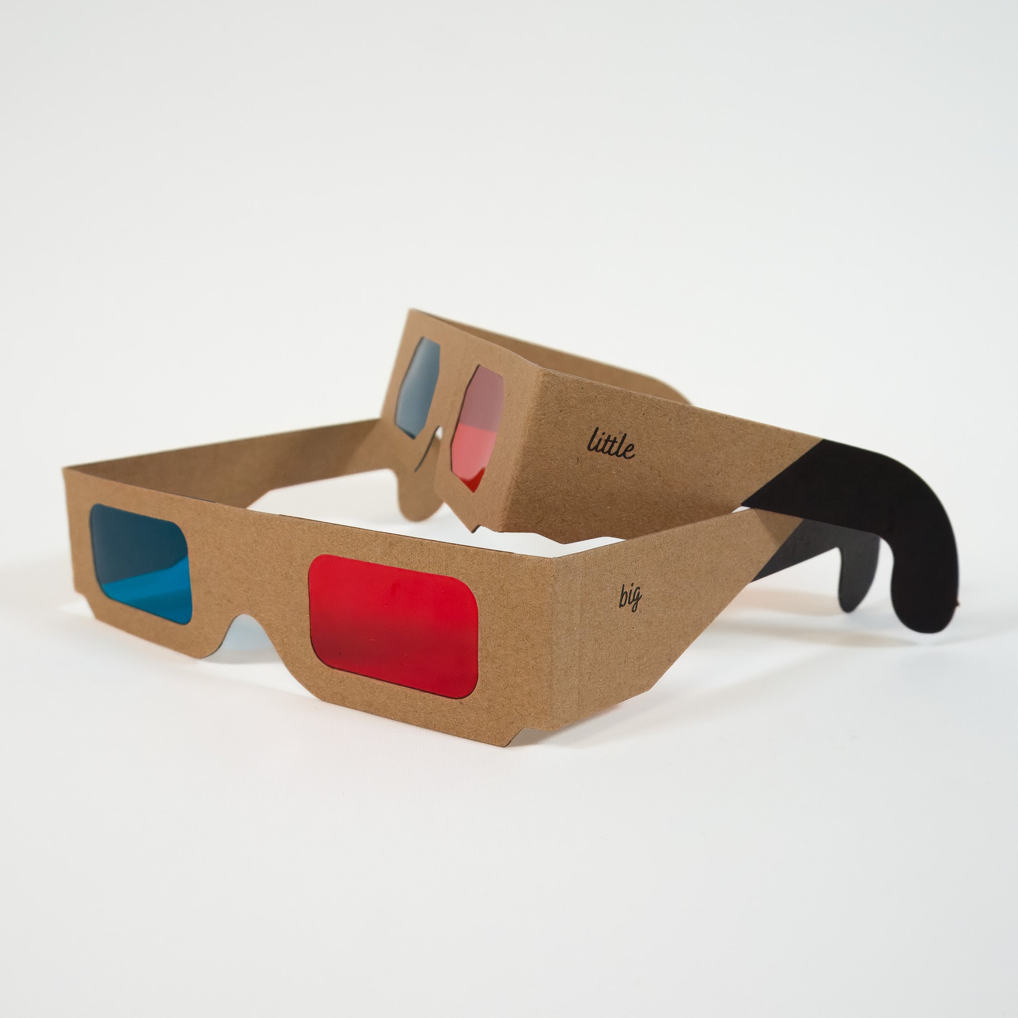 Adult and child custom designed 3D glasses stacked on top of each other