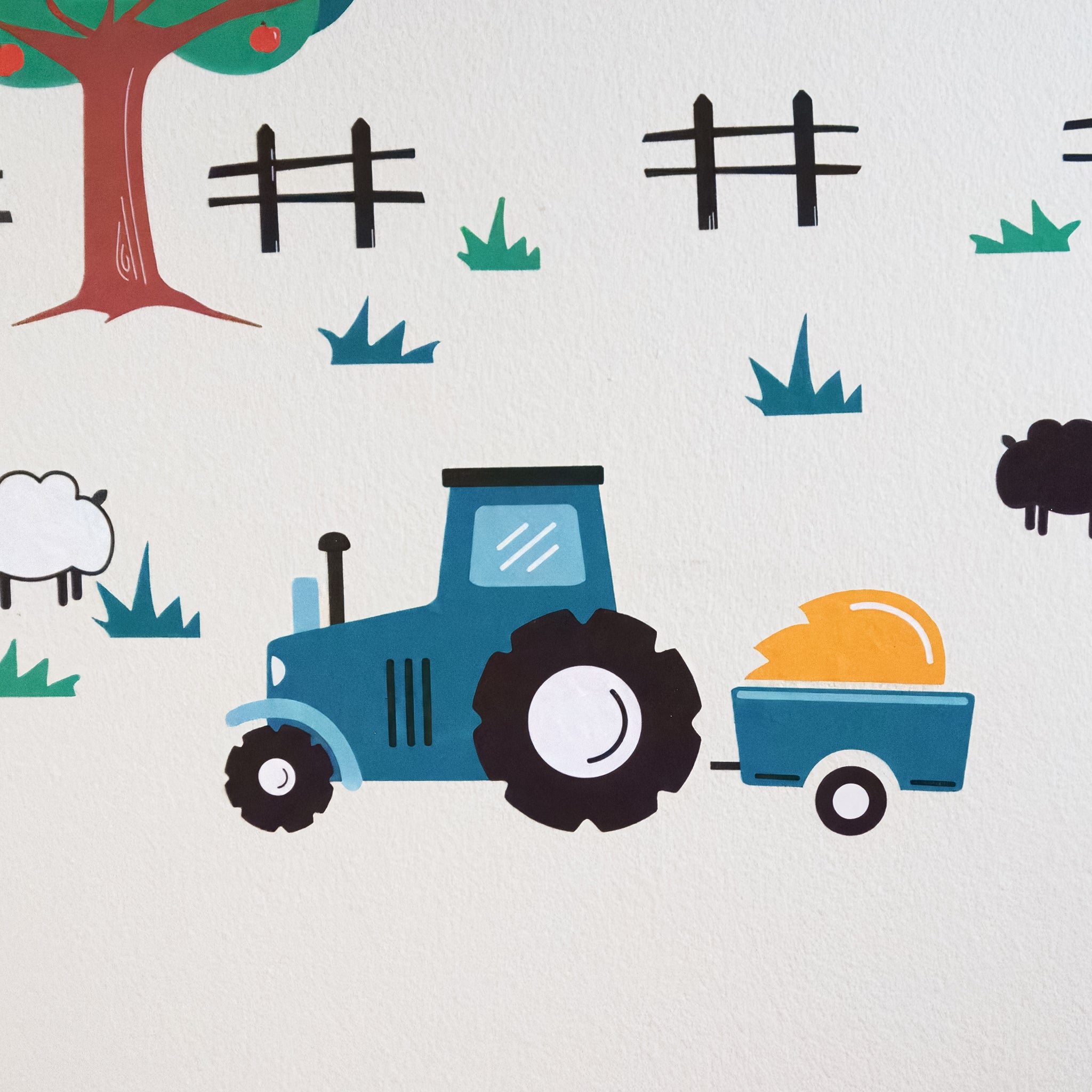 Large teal and black tractor wall decal with wagon and hay surrounded by farm fences and grass on a white wall.