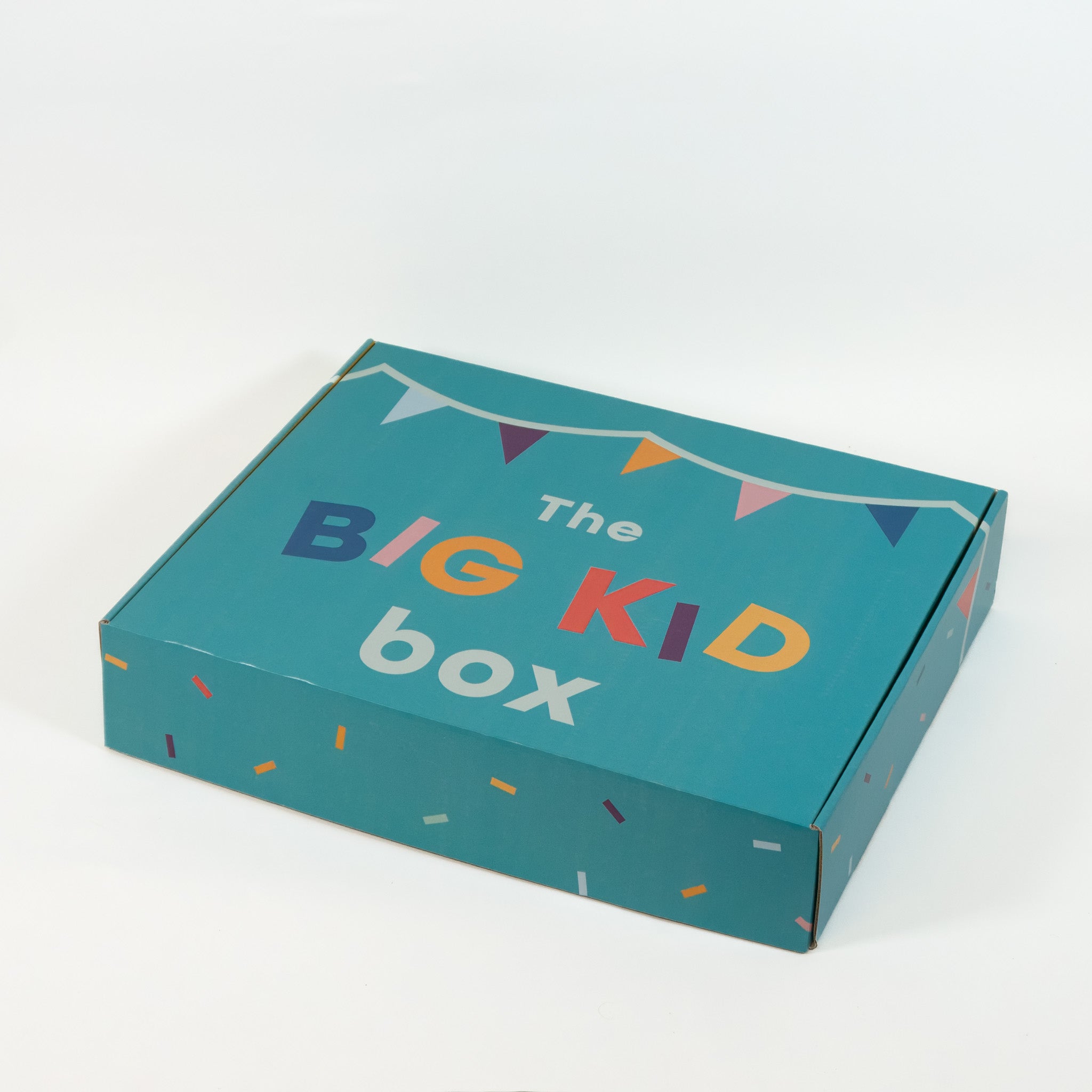 Big kid gift box closed to show outside design of confetti and banner theme