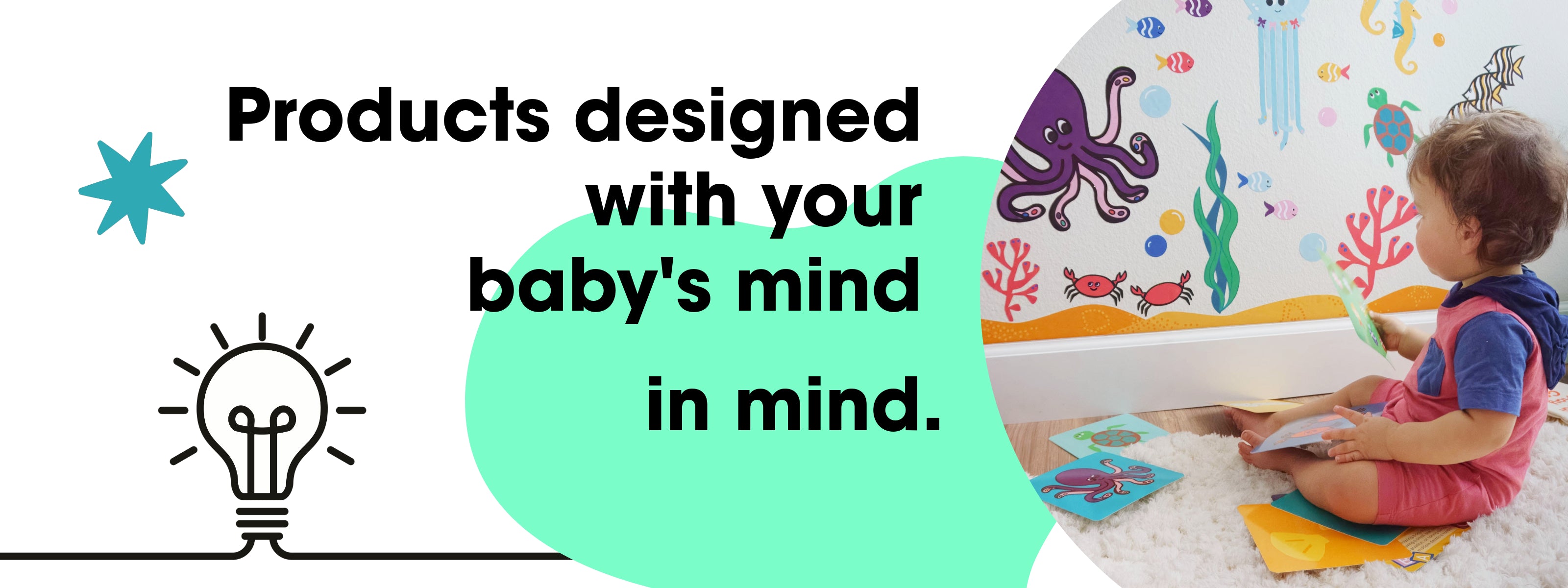 On the right, a toddler sits facing a wall with a mural in an ocean theme. He is holding colorful activity cards. The saying "Products designed with your baby's mind in mind" is written to the left with the icon of a light bulb in black and white.