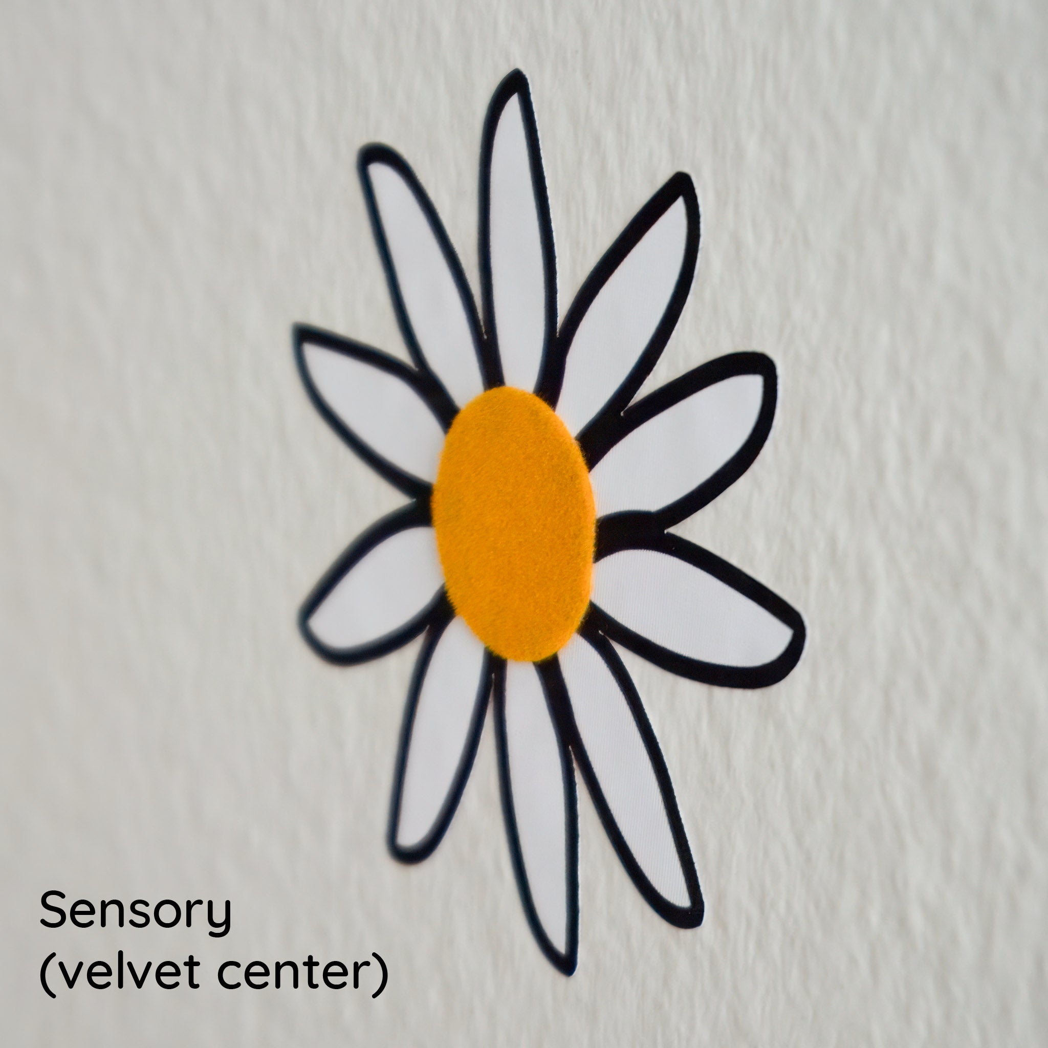 Close up of yellow velvet center of daisy wall decal